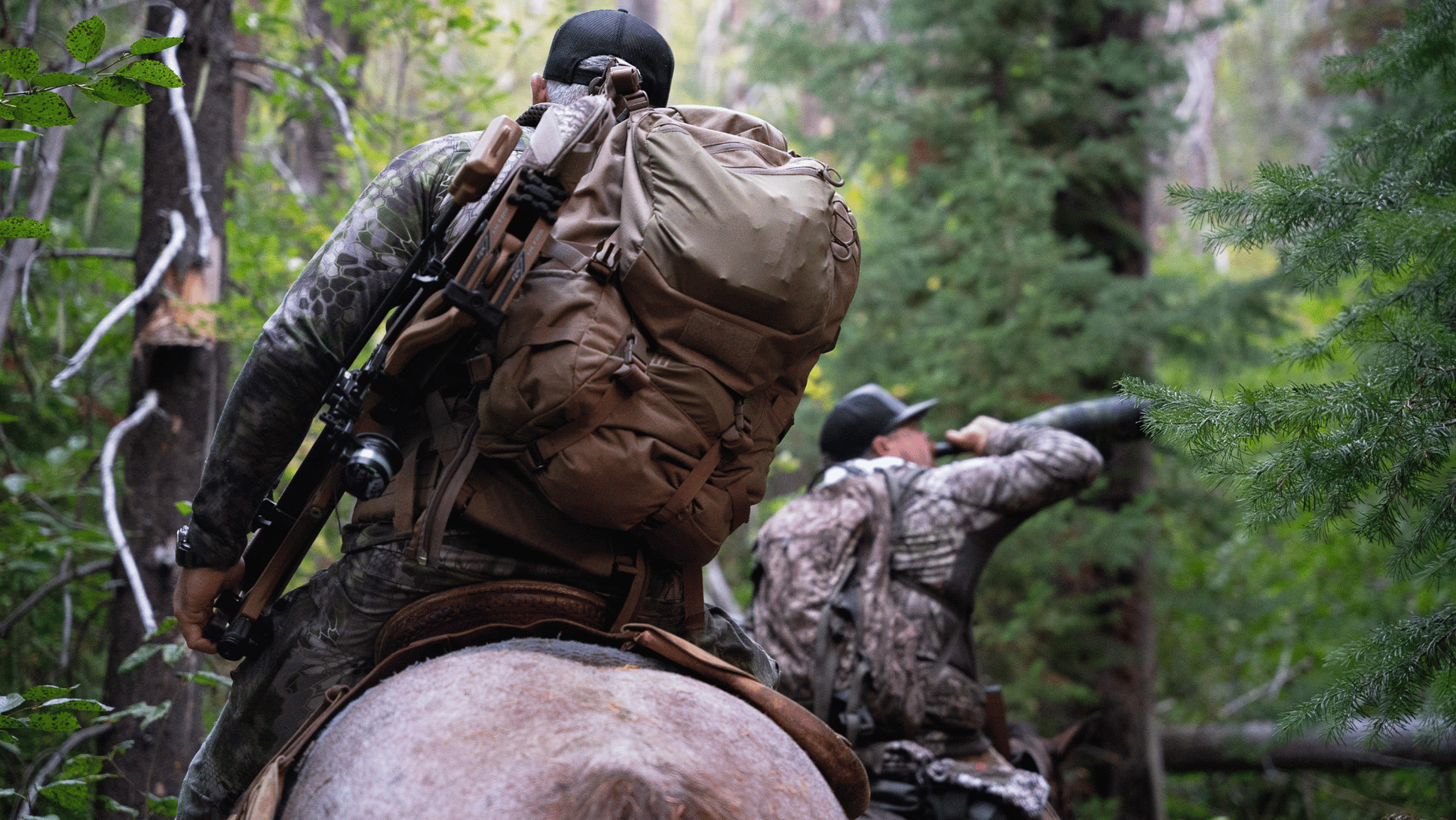 Archery elk hunter on horseback in the mountains of British Columbia, Canada.