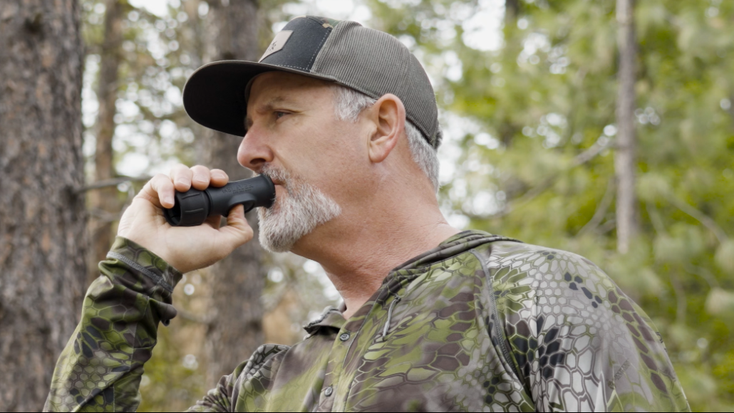 Slayer Calls CEO, Bill Ayer in the elk woods blowing the Enchantress push button cow call