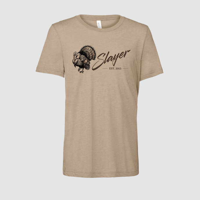 Tan t-shirt with illustration of a turkey in full strut with Slayer logo in script on light grey background.