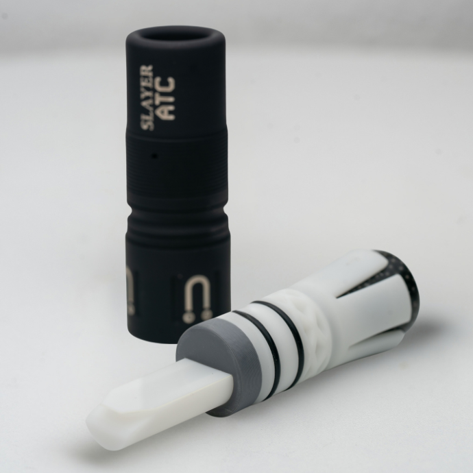 Black and white single reed ATC - Muller Chokes collaboration duck call with the Muller logo and H2O branding in cream on a light grey background.