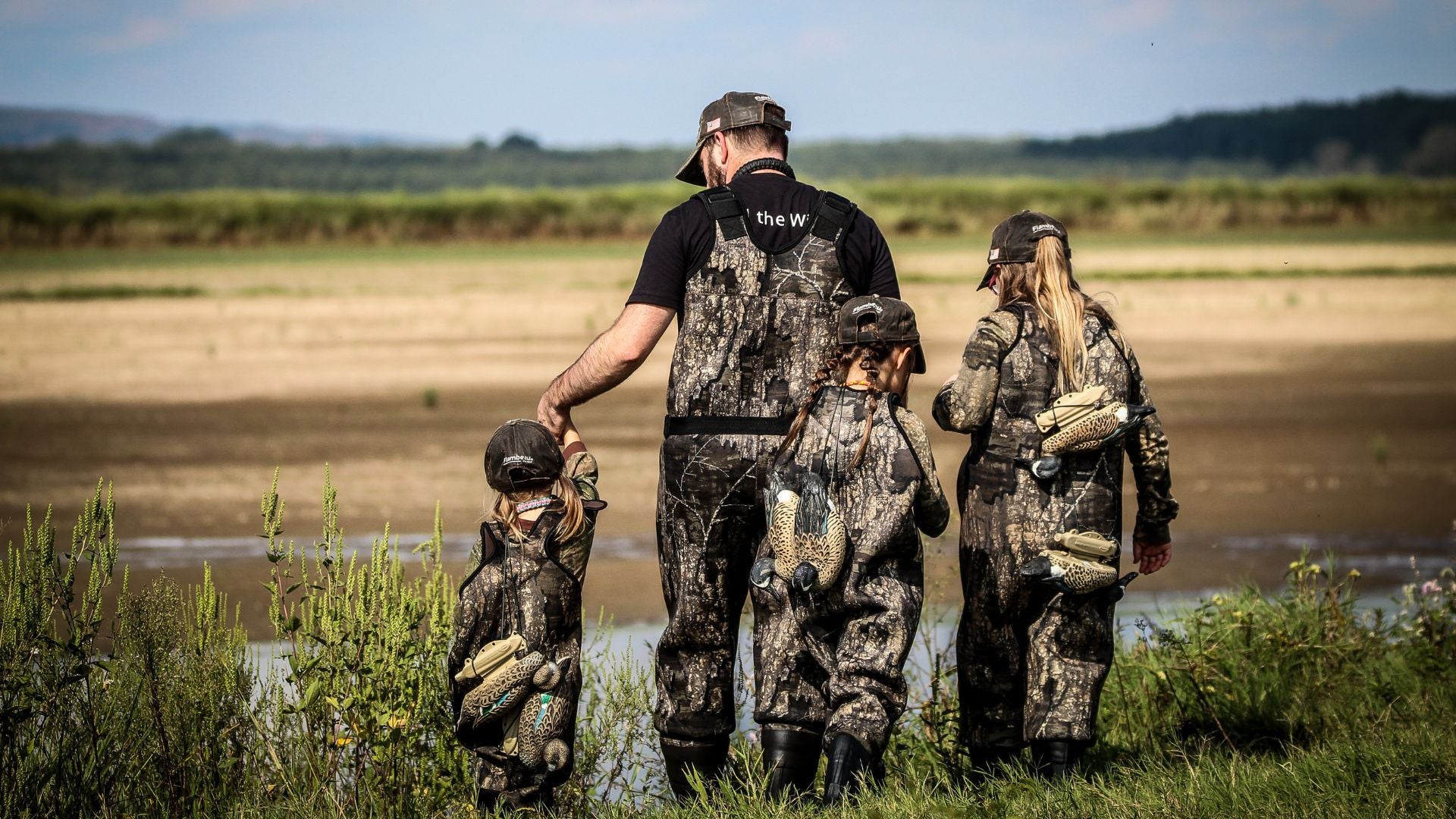 Father and his daughters hunting