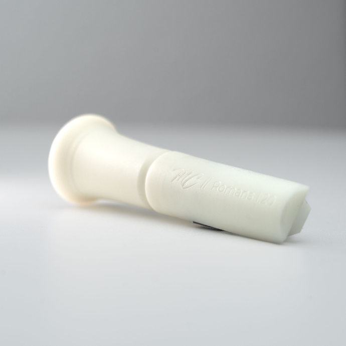 White duck call insert with "MC // Romans 1:20" engraving on a white background