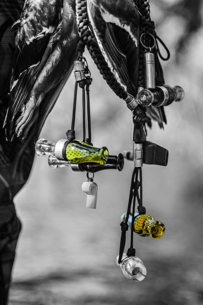 Close up of calls on a lanyard on a hunter