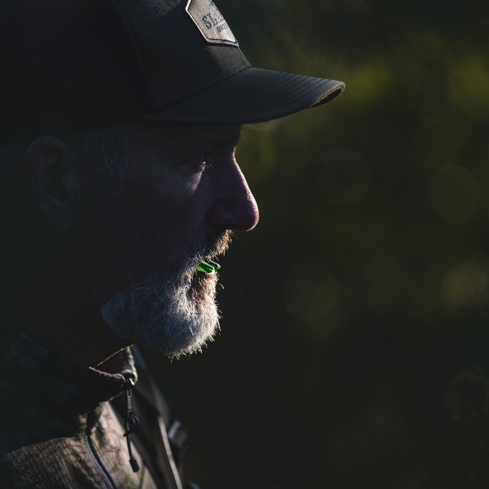 Elk hunter demonstrating the Altitude Series, 7-Pack Elk Reeds