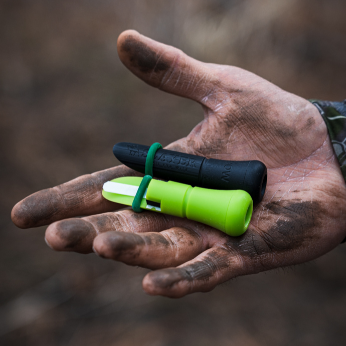 Elk hunter showing external calf and cow elk calls by Slayer Calls.