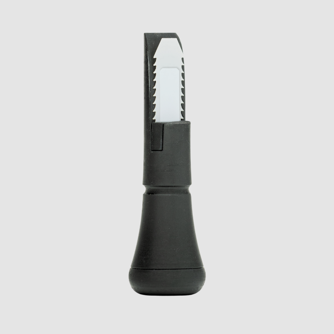 Close-up of the Slayer DUBAR duck call soundboard in black, featuring a white, freeze-resistant double reed with tooth-like edge design for optimal tone and airflow control.