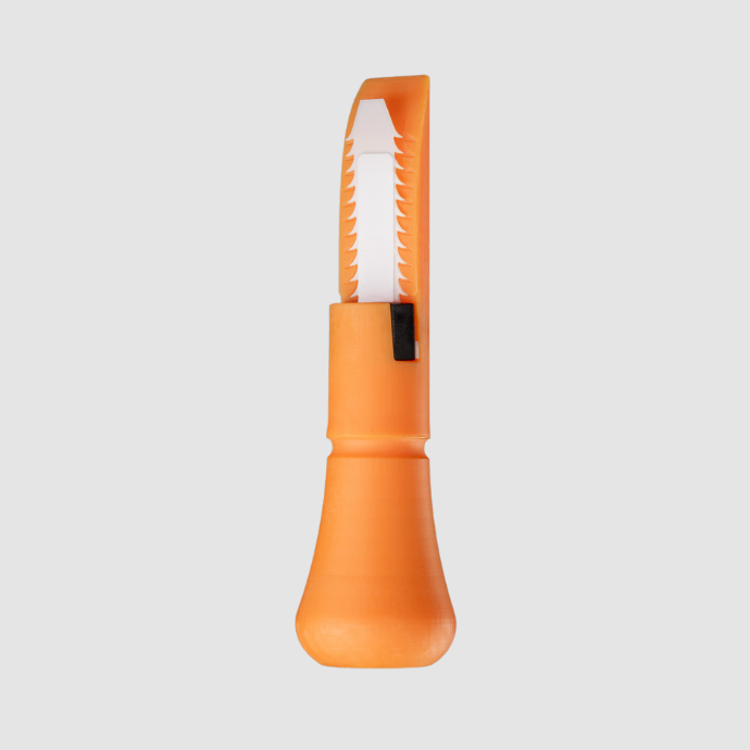 Close-up of the Slayer DUBAR duck call insert in bright orange, featuring a unique freeze-resistant reed with sawtooth edges for improved airflow and consistent performance in cold conditions.