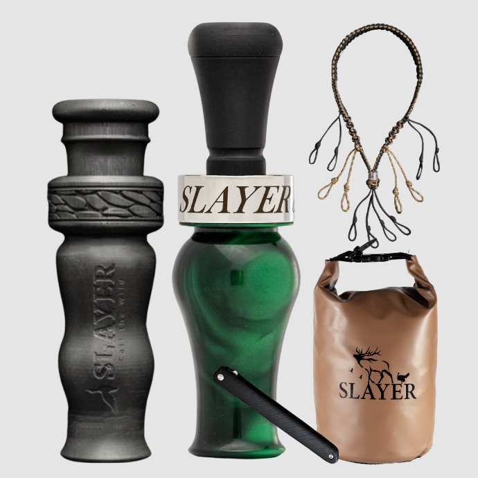 Slayer Calls duck call and duck whistle collection with Slayer's DUBAR Slayer duck call in green pearl, 4-in-1 duck whistle, lanyard, field dressing tool, and dry bag featuring SLAYER logo.