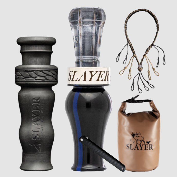 Slayer Calls duck call and duck whistle bundle with Slayer's double reed Drake Slayer duck call in dark blue acrylic with a lighter "thin blue line", 4-in-1 duck whistle, lanyard, field dressing tool, and dry bag featuring SLAYER logo.