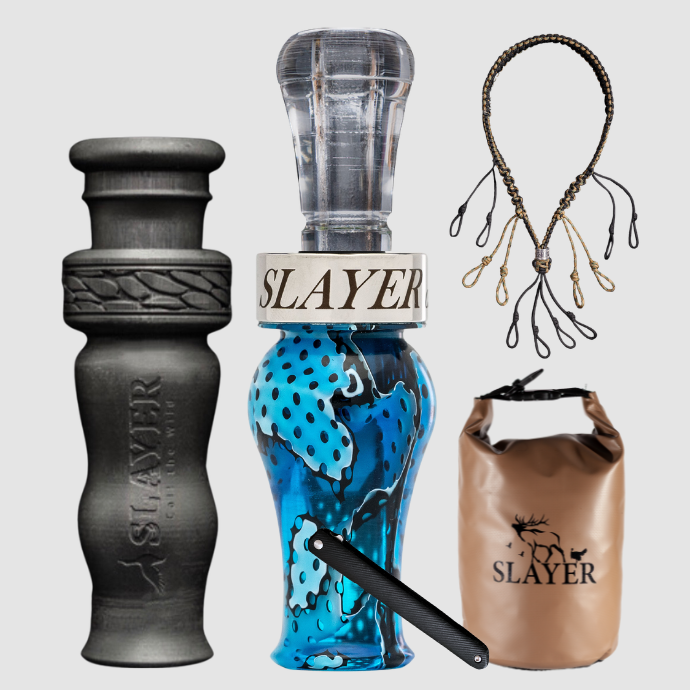 Slayer Calls duck call and duck whistle bundle with Slayer's double reed Drake Slayer duck call in blue, 4-in-1 duck whistle, lanyard, field dressing tool, and dry bag featuring SLAYER logo.
