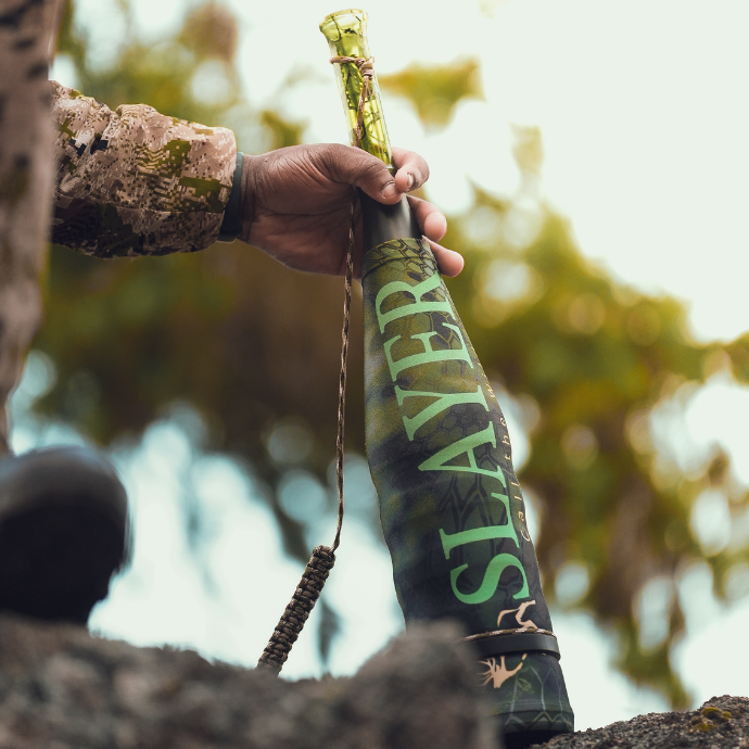 Elk hunter holding the ArchAngel bugle tube featuring Kryptek's Altitude camo sleeve
