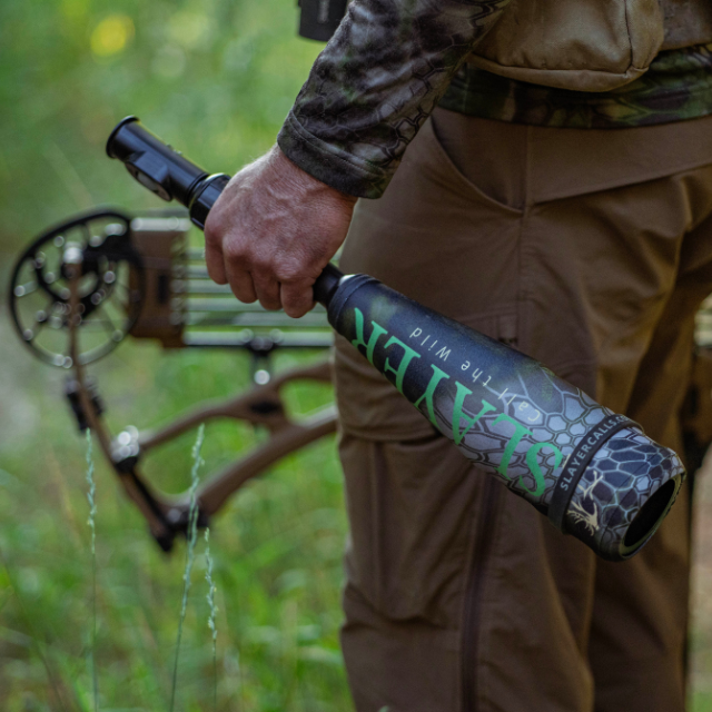 Elk hunter in the elk woods holding the Enchantress Combo - push button cow elk call attached to the Swagger bugle tube. Easy to use push button set up.