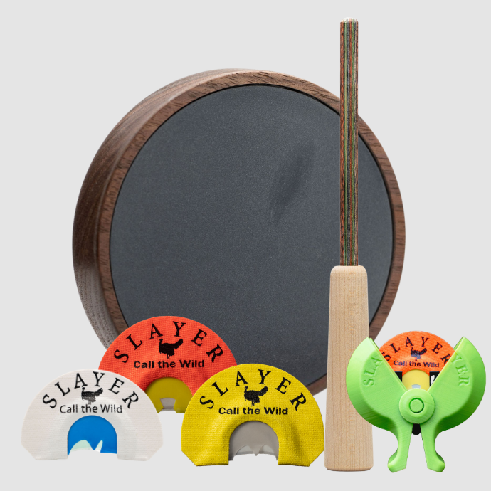 A Slayer turkey bundle including grey slate pot call and striker, 3 turkey reeds and the slayer green reed holder.