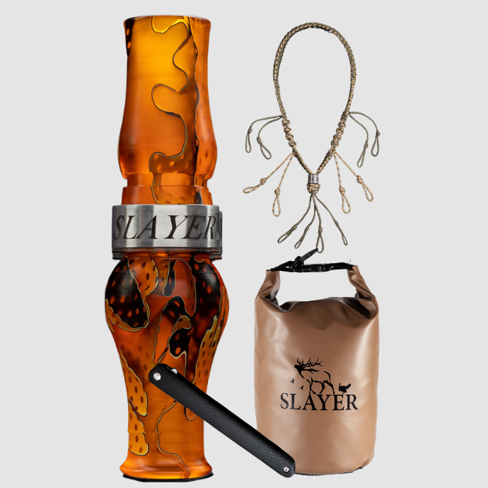 Slayer Calls goose hunting bundle including an acrylic goose call in citrine water mesh, braided call lanyard, brown dry bag with SLAYER logo, and a dressing tool.