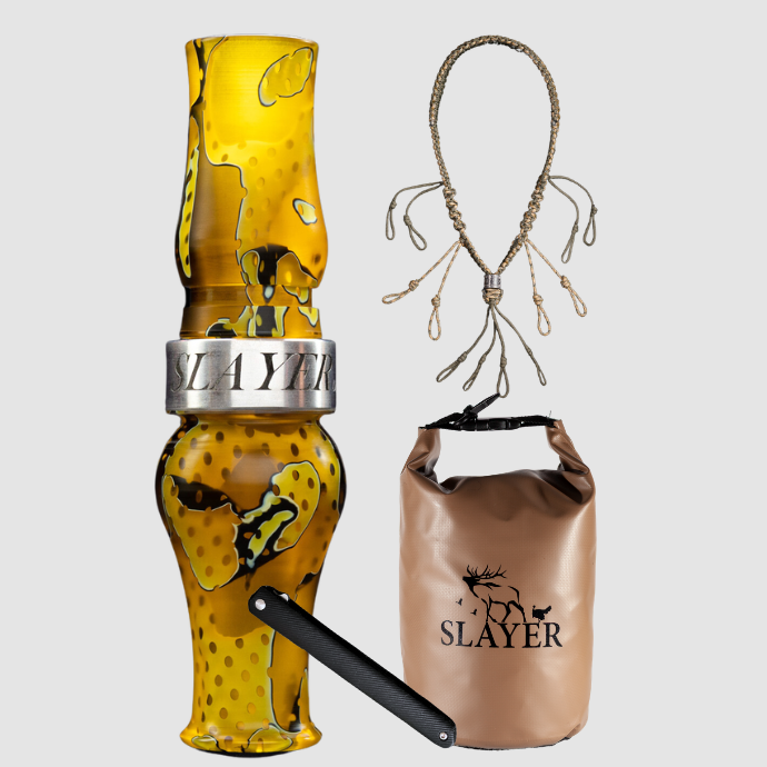 Slayer Calls goose hunting bundle including an acrylic goose call in yellowjacket mesh, braided call lanyard, brown dry bag with SLAYER logo, and a dressing tool.