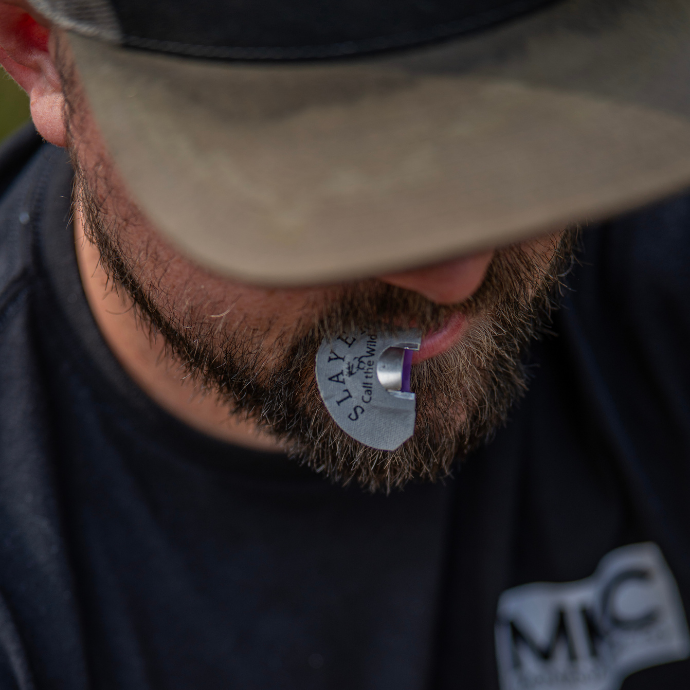 Close-up of elk hunter using grey North Fork elk reed by Slayer Calls