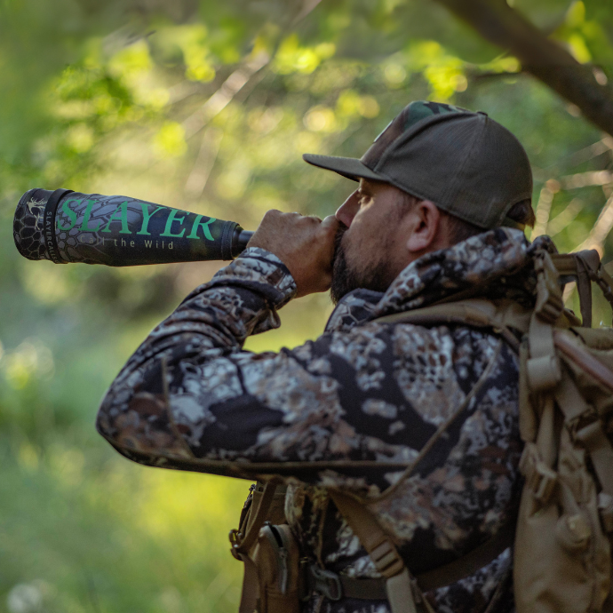 Elk hunter, Cody McCarthy blowing Slayer's Lil' Warrior bugle tube in the elk woods.
