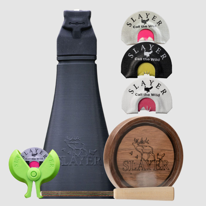 Turkey calling kit including black Gobbler Slayer, wood pot call and striker and assorted turkey mouth reeds on a light grey background.