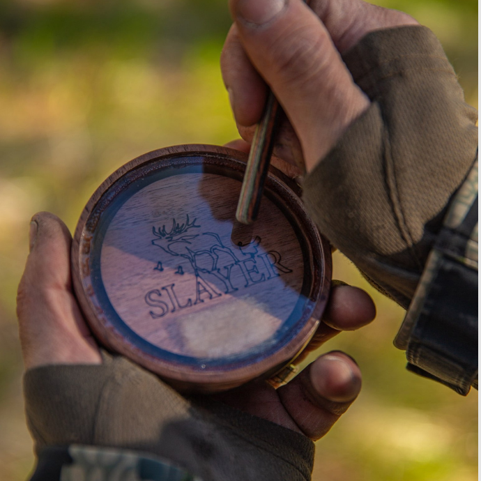 Turkey hunter uses striker to scratch the surface of the Crystal Queen Turkey Pot Call