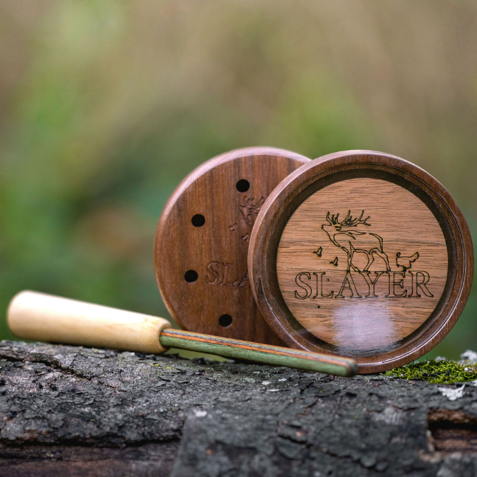 Crystal Queen Pot Call pictured with composite striker outside on tree stump