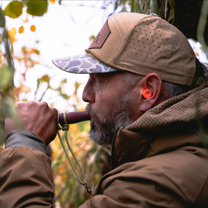duck hunter in the blind blowing the MC duck call