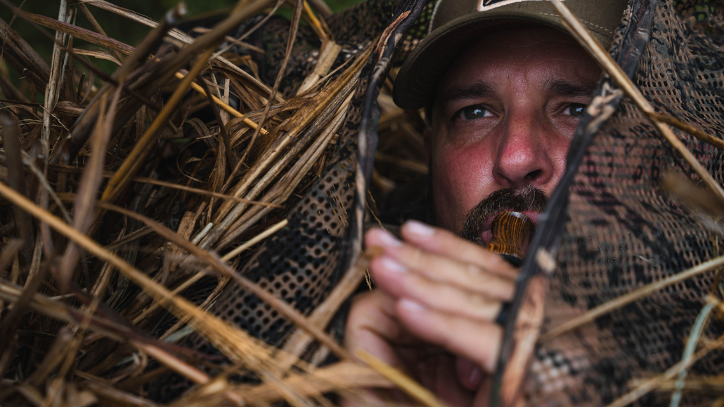 Goose hunter in the blind running Slayer's Honker Slayer goose call