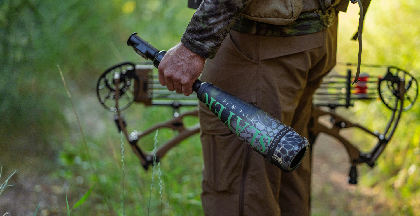 Elk hunter in the elk woods holding the Enchantress Combo - push button cow elk call attached to the Swagger bugle tube. Easy to use push button set up.