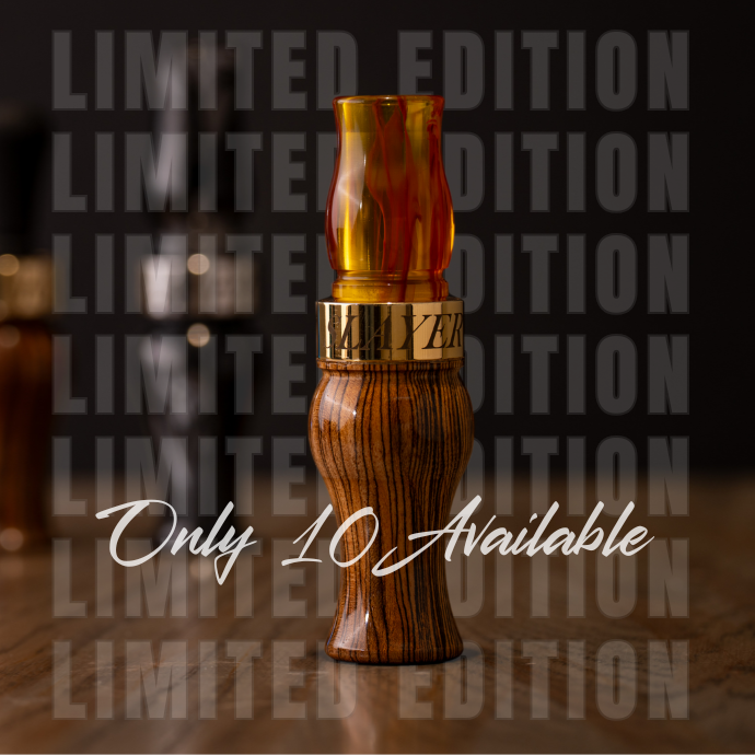 Wooden and amber-colored speck call with 'Limited Edition' text in the background