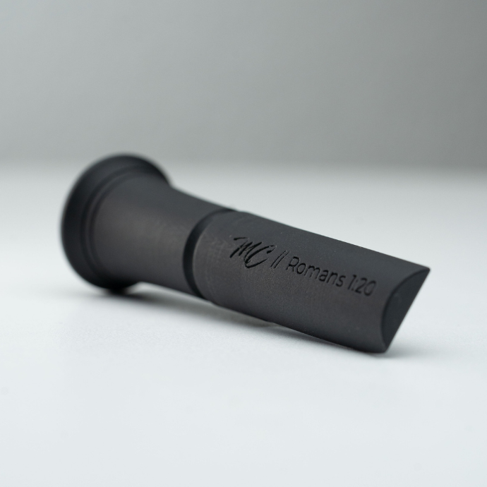 Black duck call insert with "MC // Romans 1:20" engraving on a white background