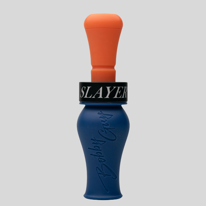 A blue and orange double reed duck call with a black collar featuring the white text 'SLAYER' and embossed 'Bobble Guys' branding on the blue body, set against a white background.