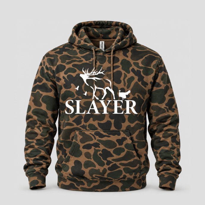 A brown and dark green camouflage hoodie with a white graphic of elk, turkey and duck silhouettes and the word 'SLAYER' printed on the chest, displayed on a neutral gray background.