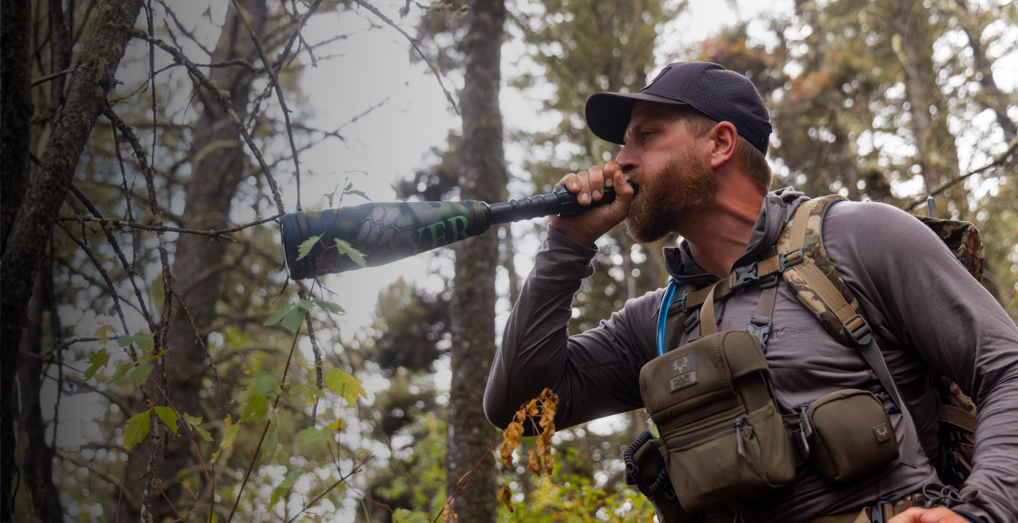 A Slayer PRO elk hunter using the Enchanted Lil' Warrior to bugle with—a push button elk call system that attaches to the compact Lil' Warrior elk bugle tube.