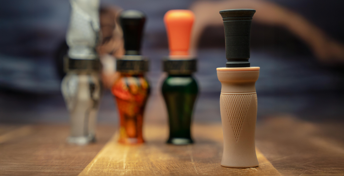 A collage of waterfowl calls — 3 are blurred while the MC duck call is in full focus. 