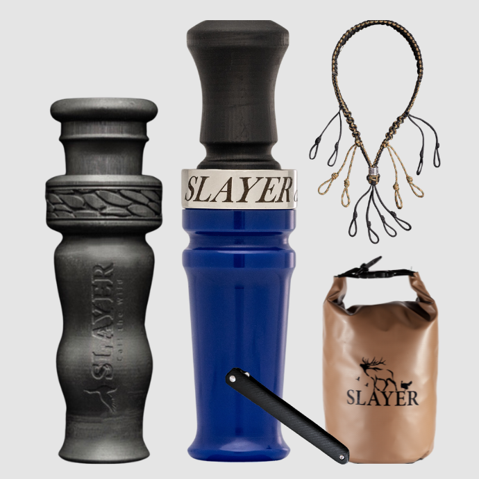 Slayer waterfowl bundle featuring deep blue acrylic duck call, black 4 in 1 duck whistle, dry bag, field dresser and lanyard on a light background.