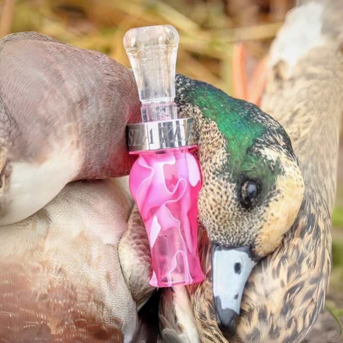 Hunter blowing the drake slayer single reed duck call in black death color