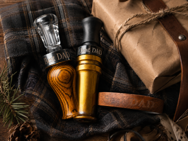 Custom duck calls from Slayer Calls—the Suzie Slayer and Yolo Bypass duck calls pictured here with custom engraved bands that say Best Dad.