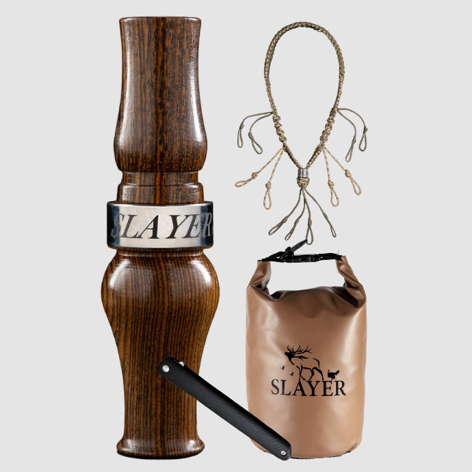 Slayer Calls goose hunting bundle including a wood goose call, braided call lanyard, brown dry bag with SLAYER logo, and a dressing tool.