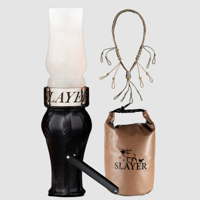 Slayer Calls goose hunting bundle including an acrylic goose call in black and white, braided call lanyard, brown dry bag with SLAYER logo, and a dressing tool.
