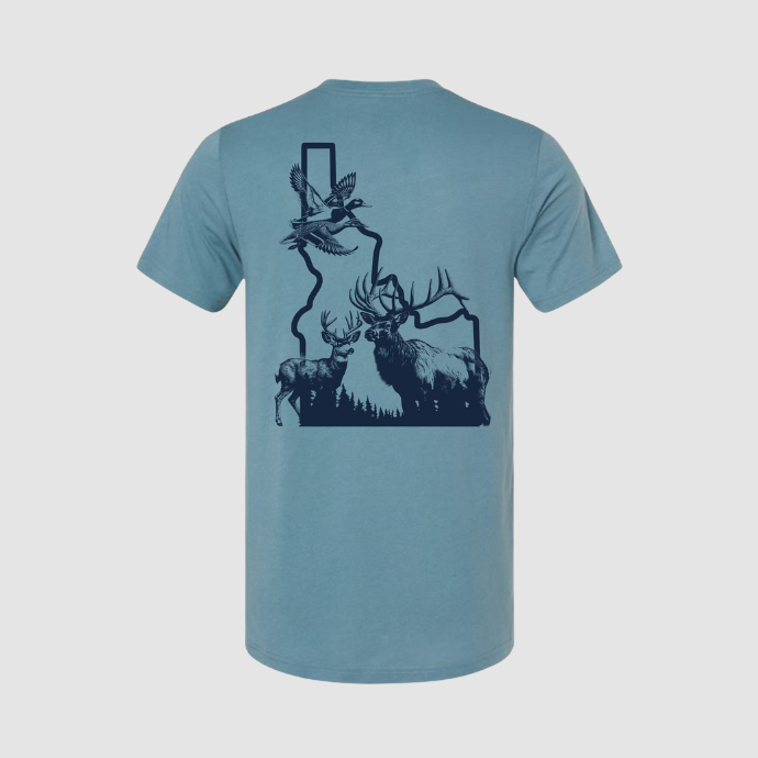 Back view of Slayer hunting T-shirt featuring elk, deer, and ducks in flight graphic overlay on Idaho state map on slate blue fabric.