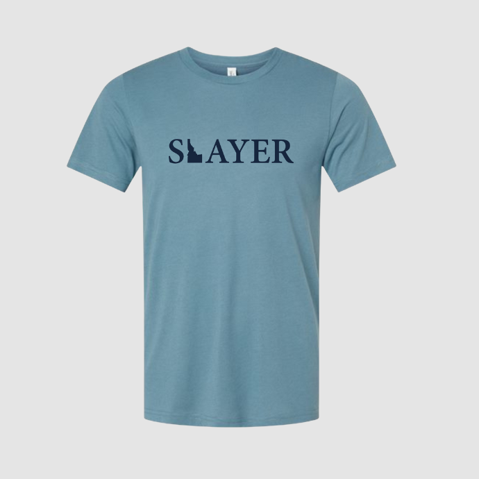 Blue t-shirt with 'SLAYER' printed on it against a light gray background