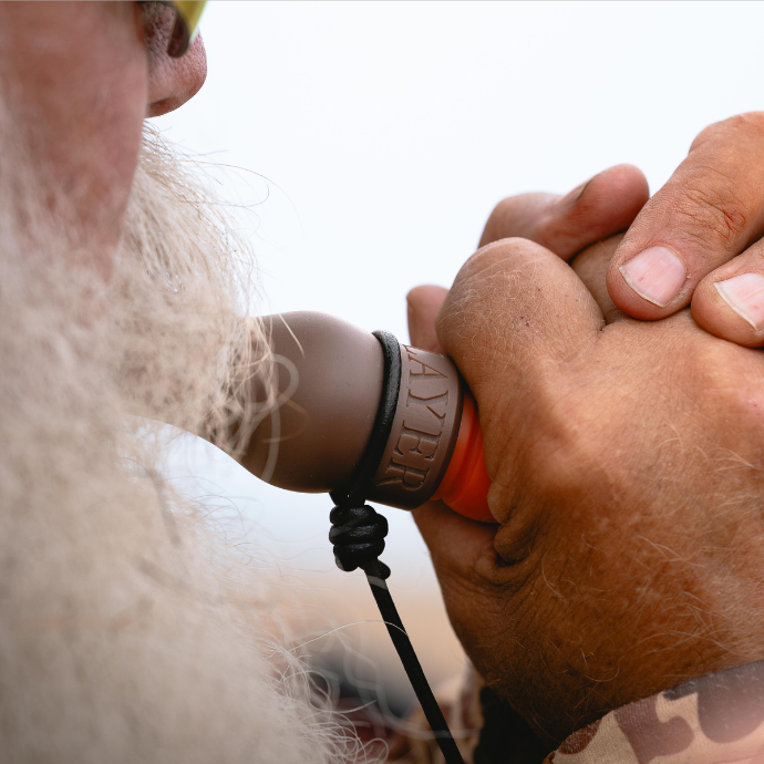 Waterfowler running the Rice Wrecker specklebelly goose call during an Arkansas speck hunt, calling flocks into the decoys.