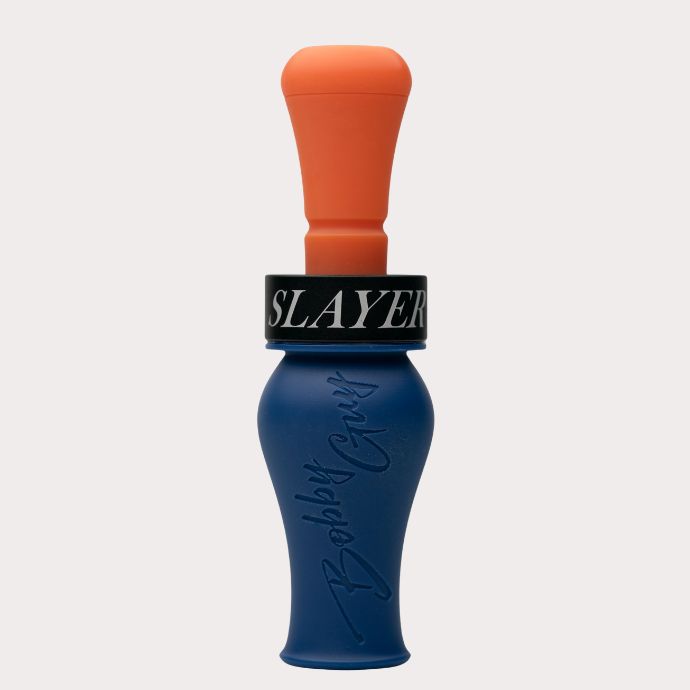A blue and orange double reed duck call with a black collar featuring the white text 'SLAYER' and embossed 'Bobble Guys' branding on the blue body, set against a white background.