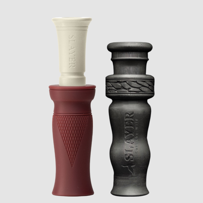 Slayer red and black duck call and black duck whistle on a light gray background.