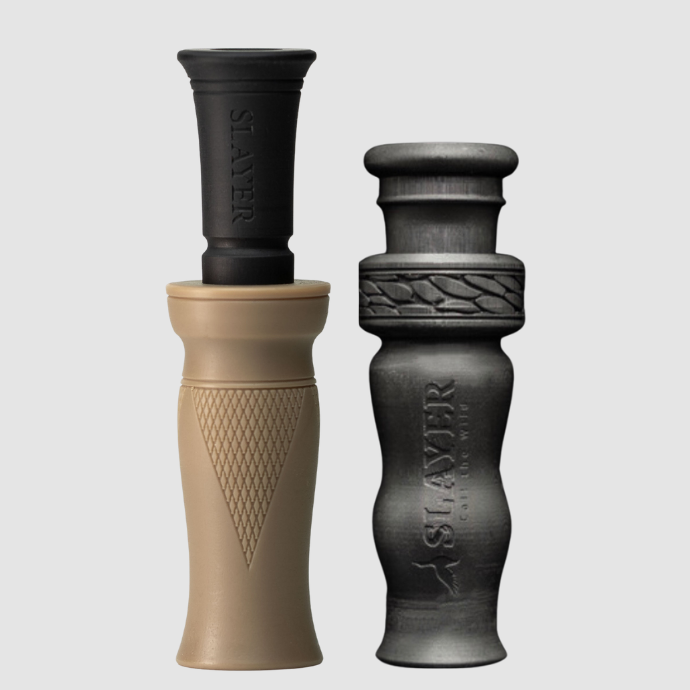 Slayer brown duck call and black duck whistle on a light gray background.