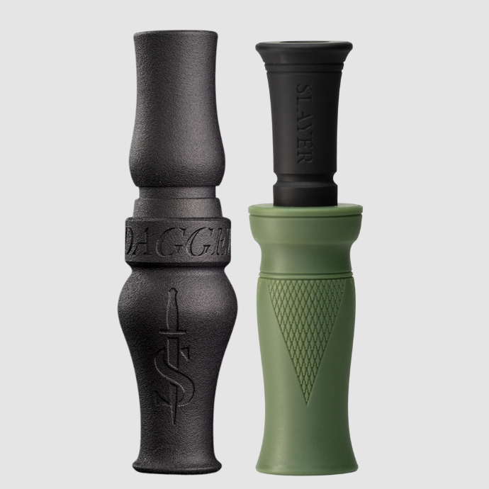 Two waterfowl calls, one black goose call and one green duck call, on a light gray background.