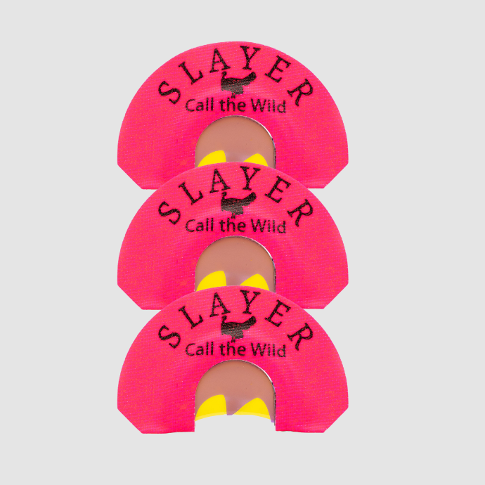 Three pink 'SLAYER Call the Wild' turkey calling reeds on a light gray background