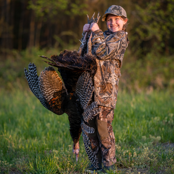 Young female hunter with turkey