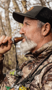 Bill Ayer, dressed in his hunting gear with the Suzie Slayer Duck Call