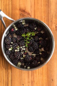 Blackberries, garlic and thyme - prepping for a blackberry bourbon sauce