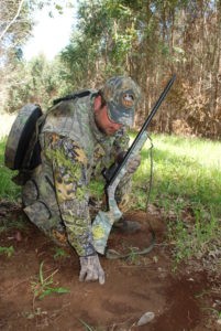 pre-season turkey scouting, hunter look at turkey tracks